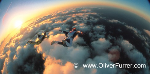 wingsuit flying soaring the sunset