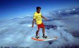 cloud skydive surfer in the blue sky